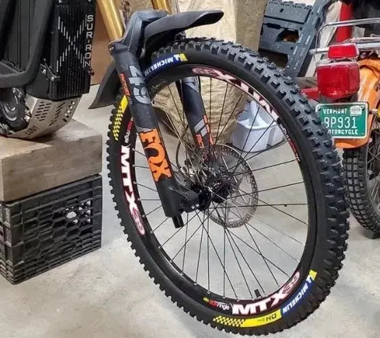 Wider tire on front online of mountain bike